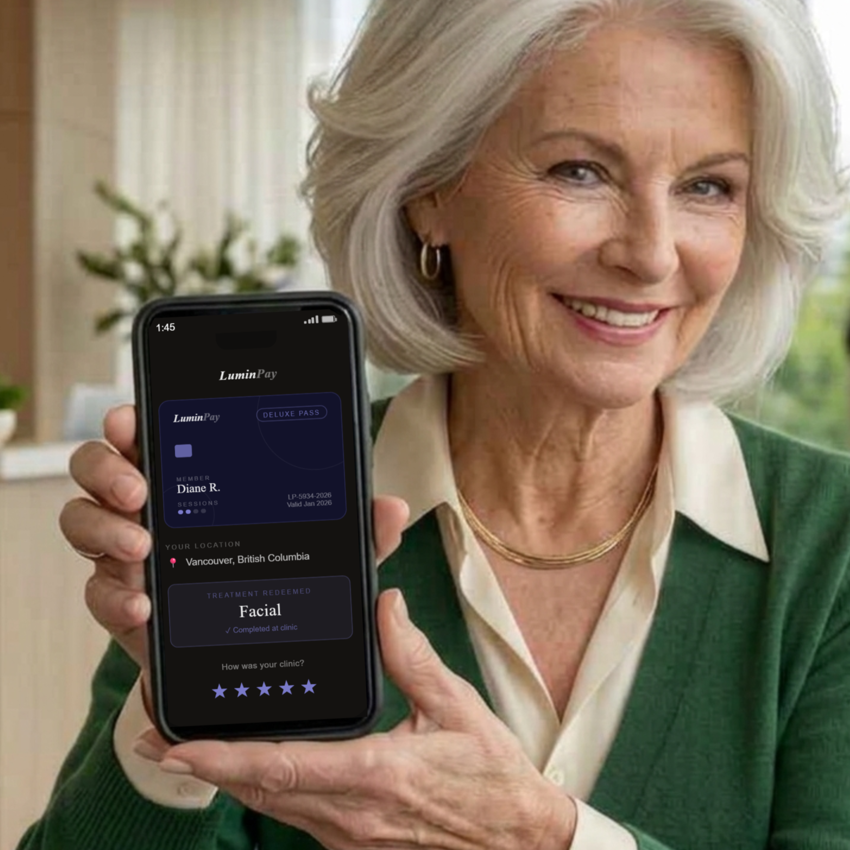 Diane smiling and holding the LuminPay pass on her phone